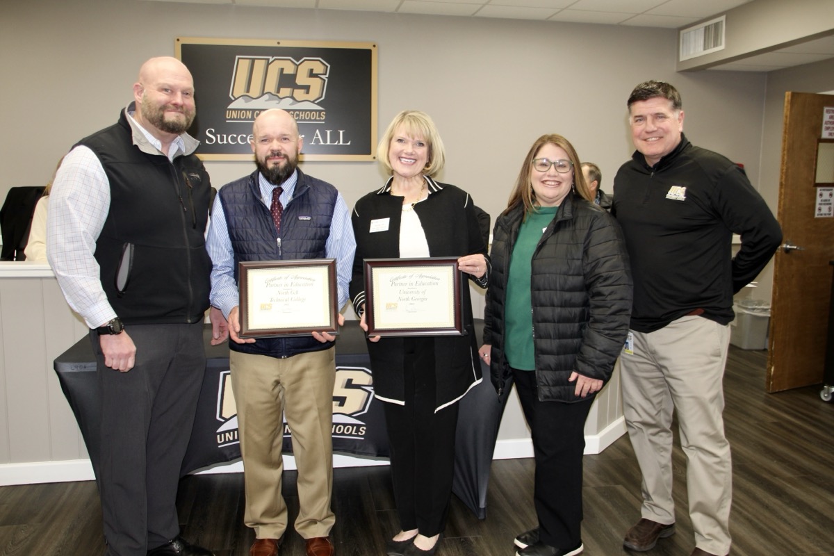 L-R: Superintendent Hill with Partners in Education Matthew Mashburn of NGTC and Sandy Ott and Suzanne Jabaley of UNG, plus Director of Teaching/Learning CT Hussion in the Jan. 23 board meeting. Photo by Shawn Jarrard