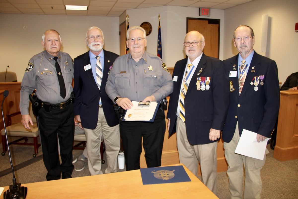 UCSO Chief Deputy John George was honored Dec. 19 for his professionalism and dedication to local law enforcement, pictured here with Sheriff Mason and members of the local chapter Sons of the American Revolution. Photo by Shawn Jarrard