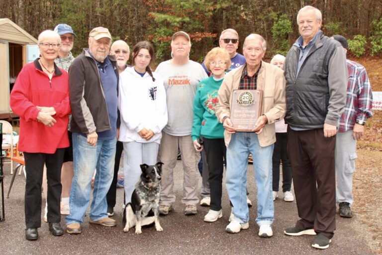 Ron Gibson, holding the appreciation plaque, was honored by Union County Government last month for his years of contributions toward local recycling. Photo by Brittany Holbrooks