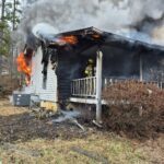 Union County Firefighters working hard to extinguish their first structure fire of the year on Forest Circle in northern Union County. Photo/Submitted