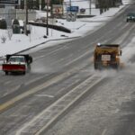 State and local road crews stayed busy over the weekend spreading salt and gravel while blading snow off thoroughfares in response to the first winter storm of the season. Photo by Shawn Jarrard