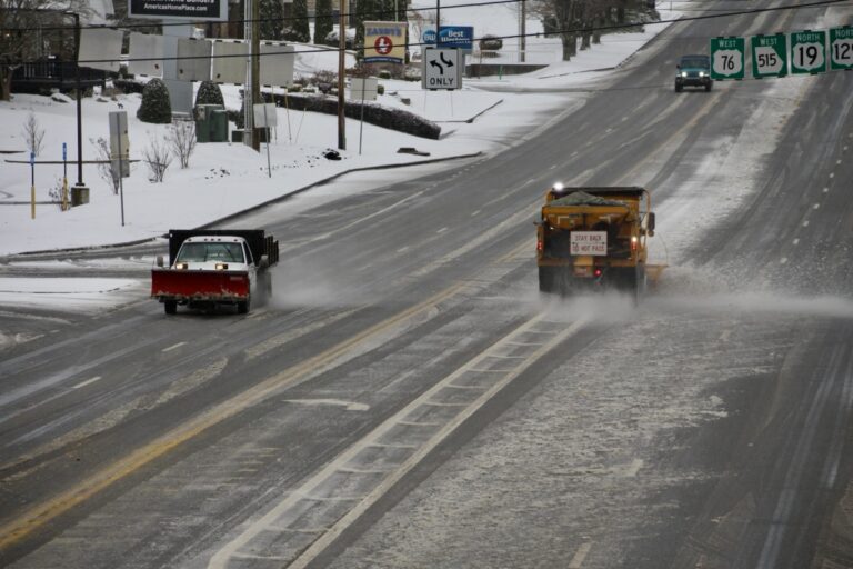 State and local road crews stayed busy over the weekend spreading salt and gravel while blading snow off thoroughfares in response to the first winter storm of the season. Photo by Shawn Jarrard
