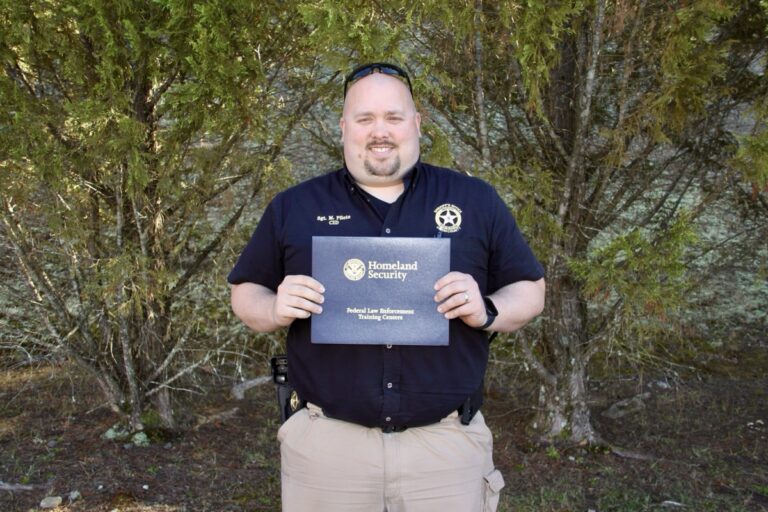 UCSO Sgt. Marc Pilote holding his Firearms Instructor certificate. Photo by Shawn Jarrard
