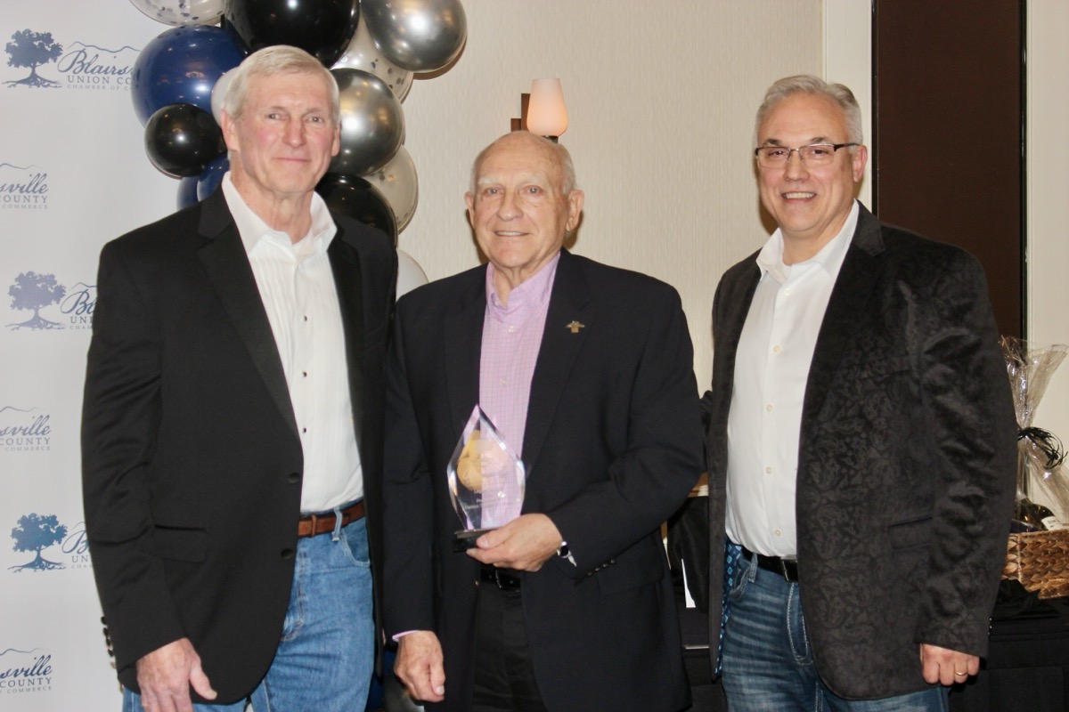 Chamber President Steve Rowe was happy to present a Legacy Award to father-son duo W.C. Nelson and Will Nelson of Nelson Tractor Co. in the chamber awards banquet last month. United Community Bank also received a Legacy Award that evening. Photo by Brittany Holbrooks