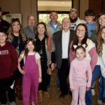 Mayor Jim Conley enjoyed the company of multiple generations of family members alongside the dozens of friends who attended his Feb. 22 retirement party. Photo by Shawn Jarrard