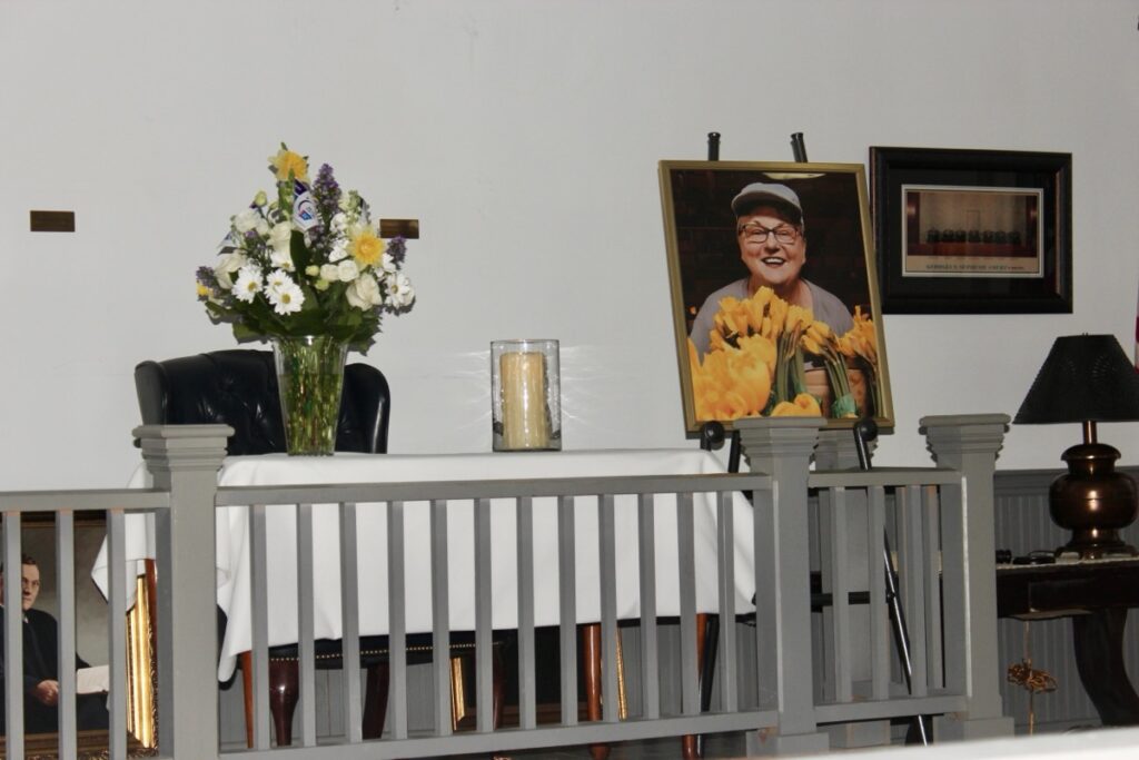 Allyson McGraw’s portrait accompanied a lovely bouquet of flowers during a Celebration of Life in honor of her passing in December. Photo by Brittany Holbrooks