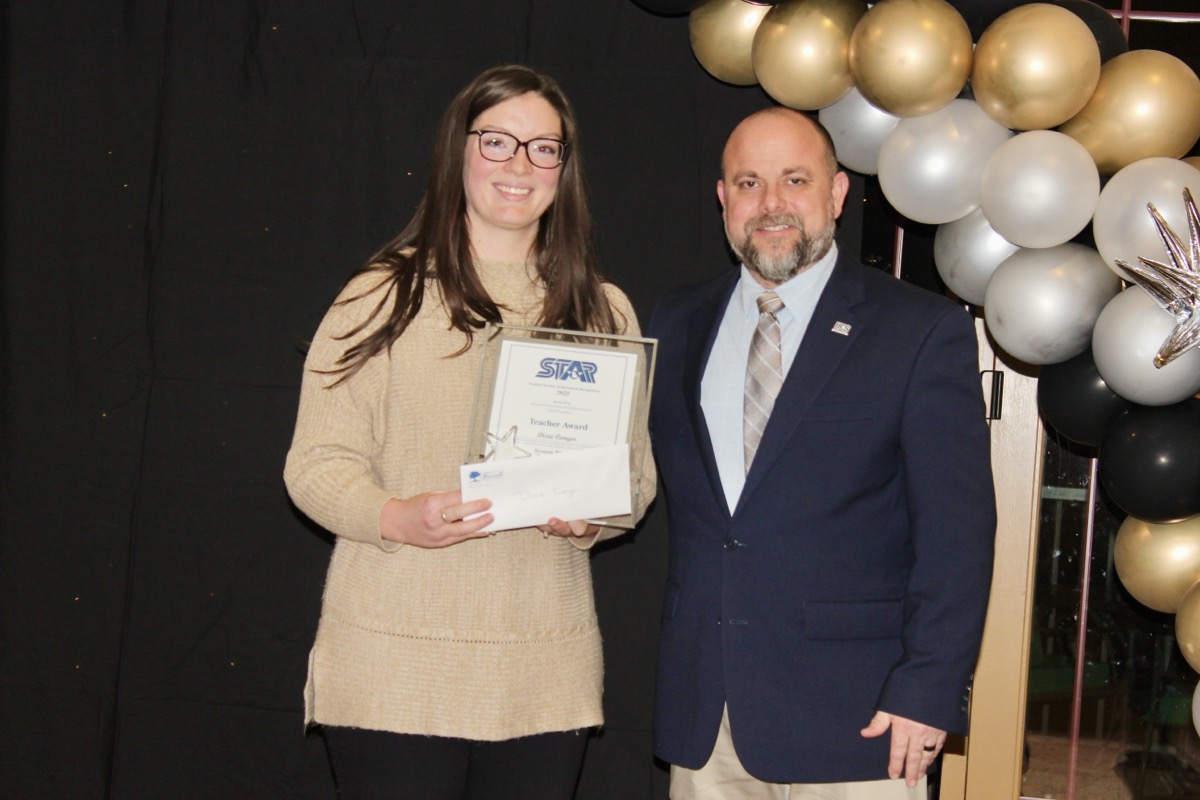 Dixie Conger received her STAR Teacher Award from UCHS Principal Josh Davis on Feb. 13. Photo by Brittany Holbrooks