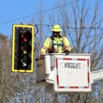An employee with the Georgia Department of Transportation inspecting the installation of a new traffic light at Gainesville Highway and Shoe Factory Road on Jan. 28. Photo by Shawn Jarrard