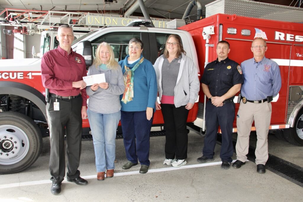 L-R: Fire Chief David Dyer presenting a donation check to Relay For Life volunteers Wendy Holden, Sue Upchurch and Cathy George, with Fire Capt. Justin Blanchard and Battalion Chief Richard Jones. Photo by Shawn Jarrard