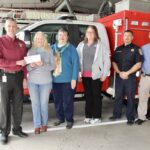 L-R: Fire Chief David Dyer presenting a donation check to Relay For Life volunteers Wendy Holden, Sue Upchurch and Cathy George, with Fire Capt. Justin Blanchard and Battalion Chief Richard Jones. Photo by Shawn Jarrard