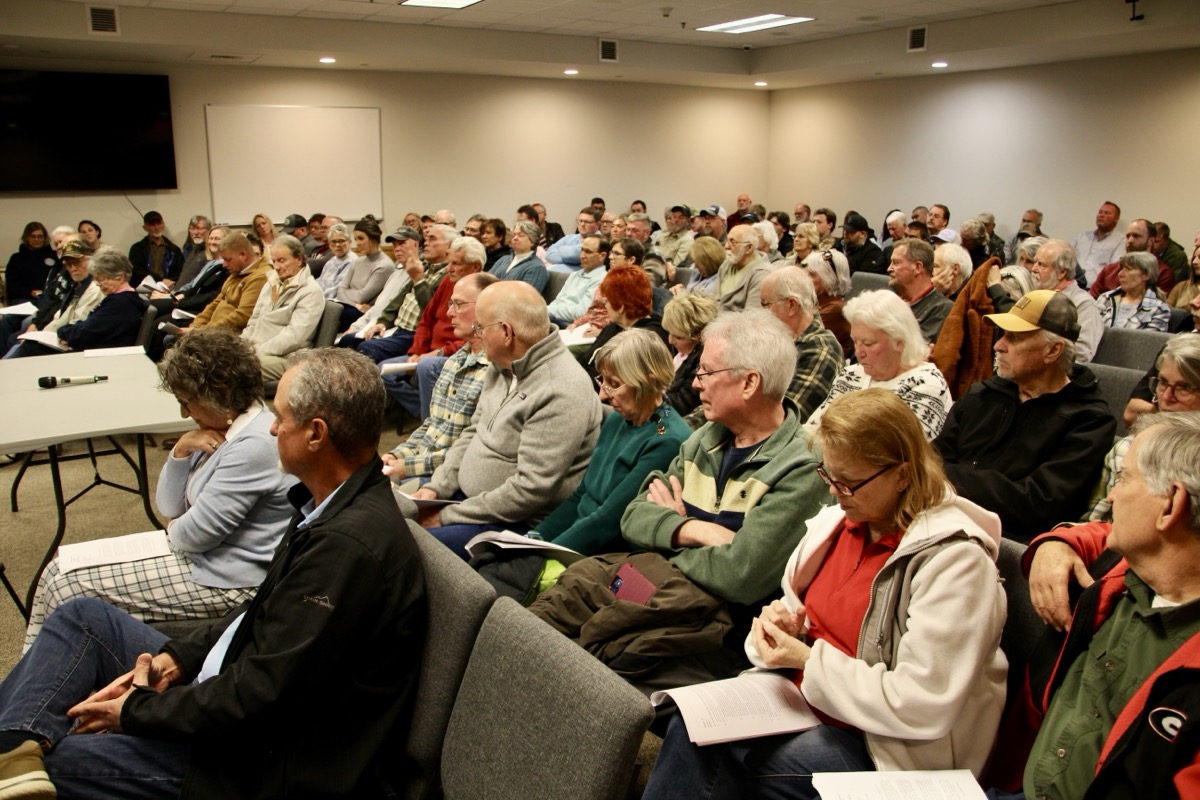 An estimated 150 people attended the March county meeting, marking the third month in a row that new Commissioner Harold Collins has had to use the large Jury Assembly Room to host meetings. Photo by Shawn Jarrard