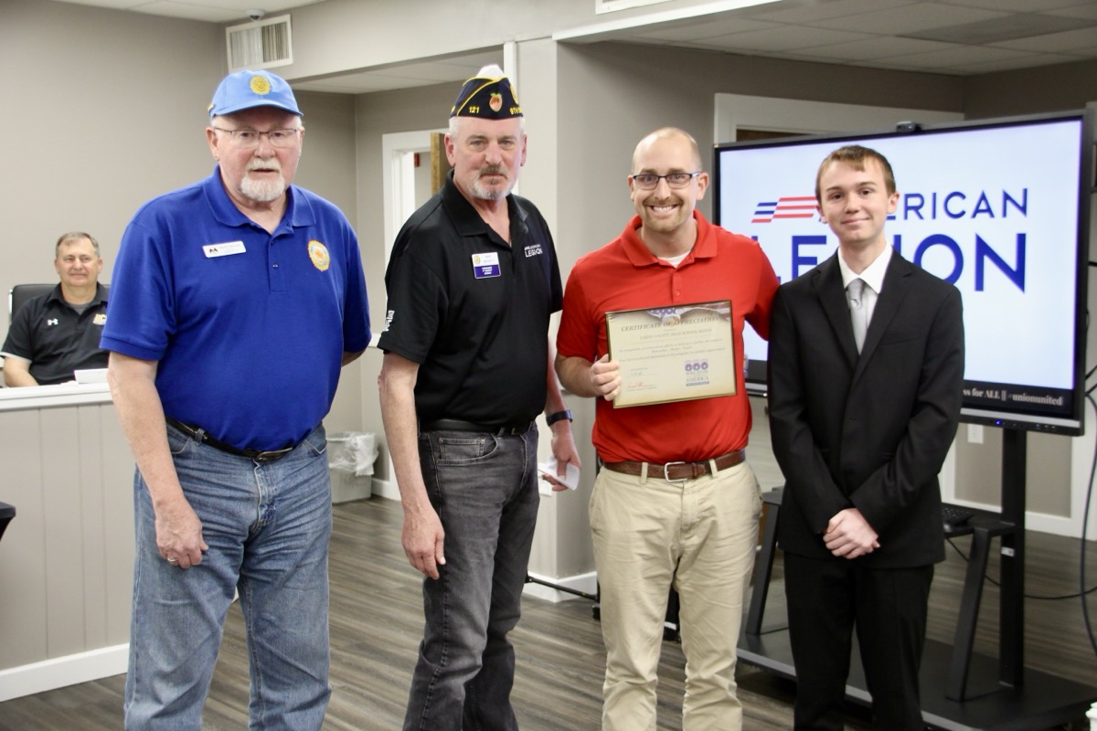 (L-R) American Legion Veterans David Patterson and Mike Merritt presented the UCHS Bands with a certificate of appreciation, accepted by Band Director Will Stafford and senior trumpet player Jeremiah Frizzell on March 18. Photo by Shawn Jarrard