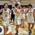 L-R: Maddox Young (11), Houston Henry (2), Ethan Hogsed (1) during a postgame celebration from the Panthers’ Final Four win over Tattnall County. Photo by Todd Forrest