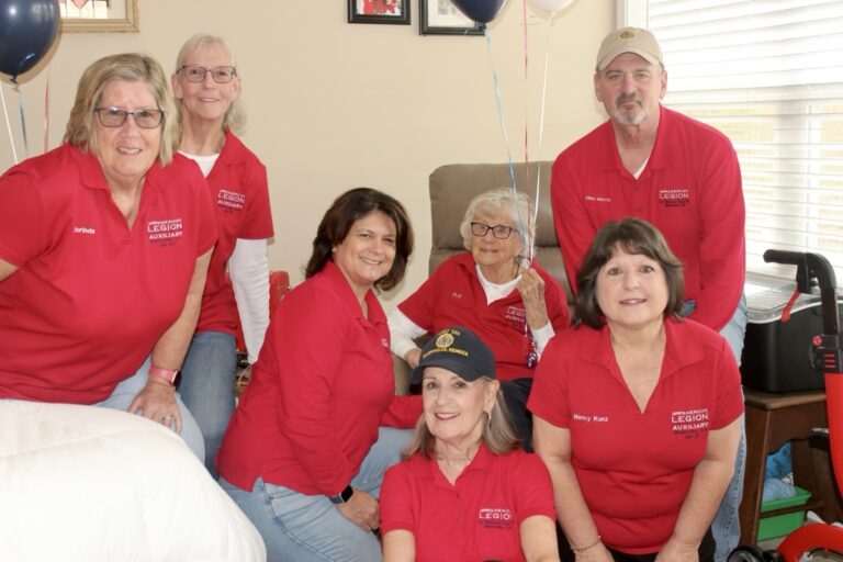 Veteran Flo Gerrard, seated in the back, enjoyed her recent visit from members of the American Legion Post 121 and Auxiliary. Photo by Brittany Holbrooks