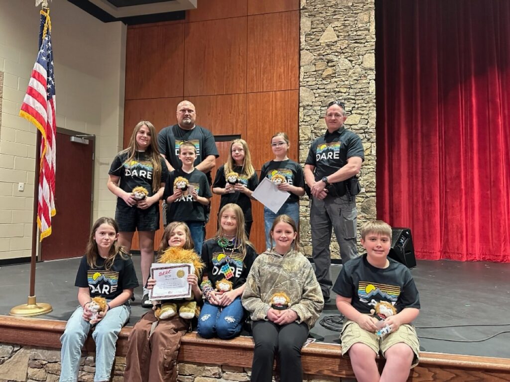 Several talented fifth-grade essayists earned recognition recently for effectively communicating what they learned in the DARE Program this year. Photo/Submitted