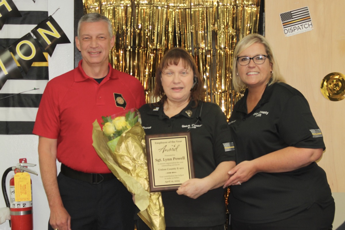 911 Director David Dyer, 911 Sgt. Lynn Powell and 911 Lt. Mille Baxter during National Public Safety Telecommunicators Week on April 14. Powell is pictured here receiving the Employee of the Year Award. Photo by Brittany Holbrooks