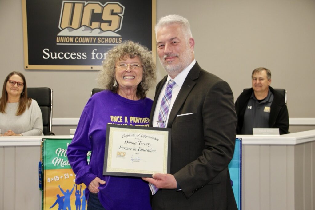 Retired educator Donna Towery has received a Partner in Education Award for her positive energy, ongoing care for students and faculty, and overall unwavering support of Union County Schools, pictured here with Dr. David Murphy. Photo by Shawn Jarrard