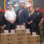 (L-R) Evan Bruck, David Dyer, Tony Pritchett, Amanda Jones and Tommy Long during the big smoke alarm donation at Fire Station No. 1. Photo by Brittany Holbrooks
