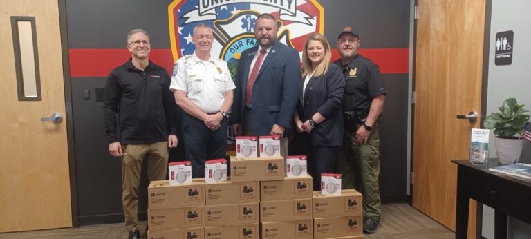 (L-R) Evan Bruck, David Dyer, Tony Pritchett, Amanda Jones and Tommy Long during the big smoke alarm donation at Fire Station No. 1. Photo by Brittany Holbrooks