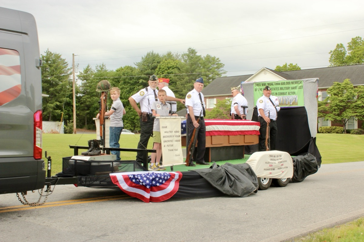 In Saturday’s parade, the North Georgia Honor Guard provided a compelling visual of a flag-draped coffin to showcase the reason behind Memorial Day. Photo by Brittany Holbrooks