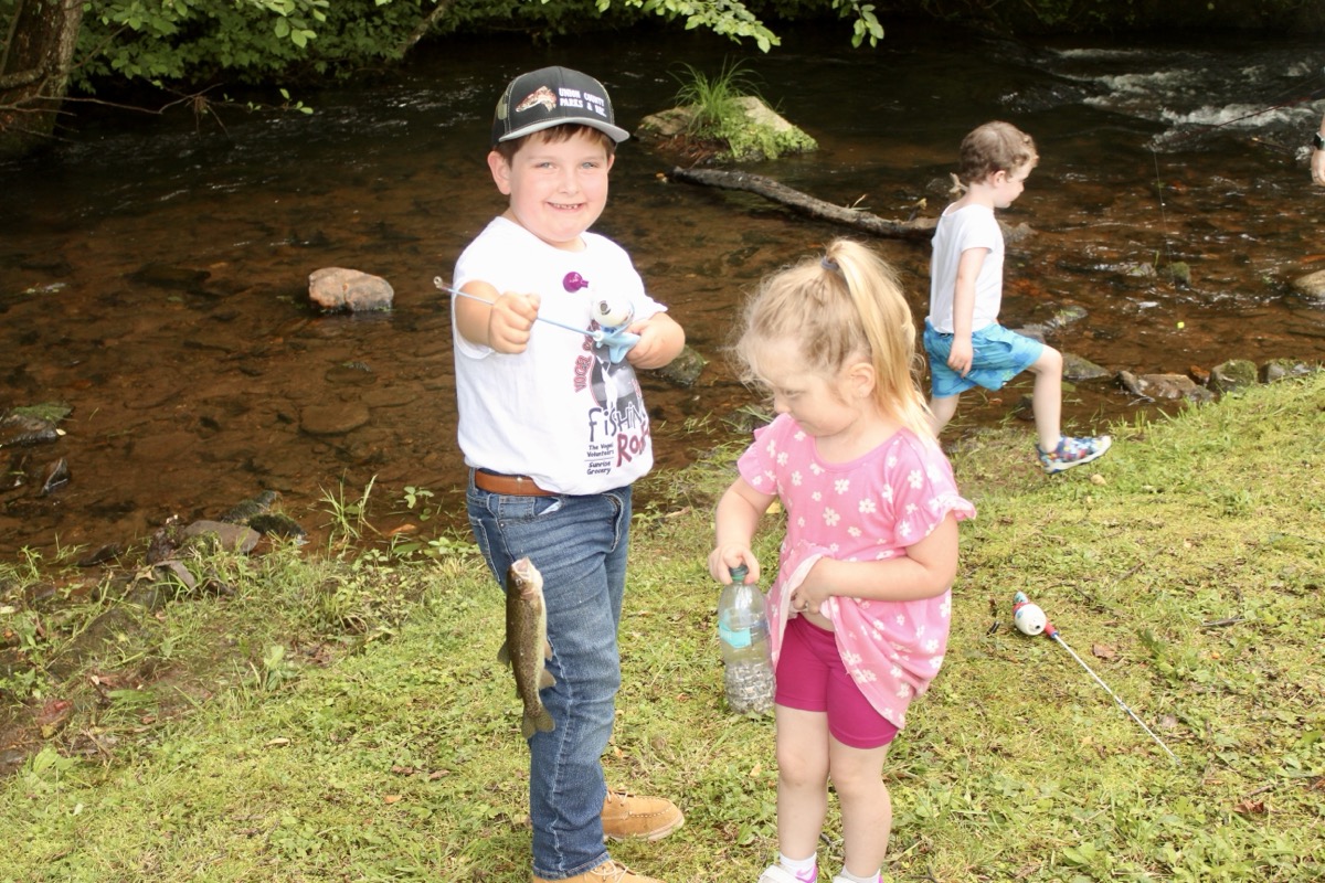 Sporting cool Fishing Rodeo apparel, Grayson Nix had a great time at the Reece Farm May 28, pictured here with his kid sister Hadleigh. Photo by Brittany Holbrooks