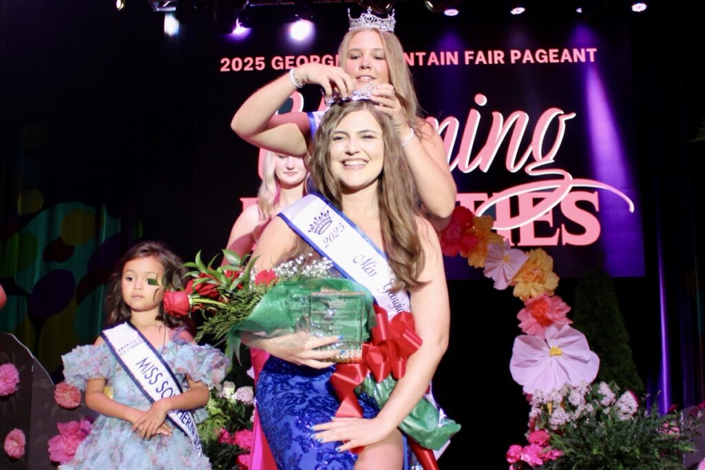 2024 Miss Georgia Mountain Fair Rylee Kitchens crowning a new Queen of the Fair for 2025, Amelia Kenlee Shook of Towns County. Photo by Lowell Nicholson
