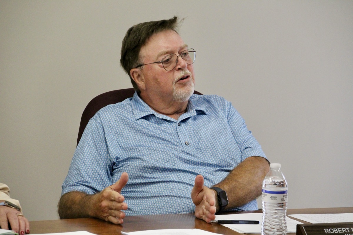 Blairsville Mayor Buddy Moore talking over an agenda item with council members on July 8. Photo by Shawn Jarrard