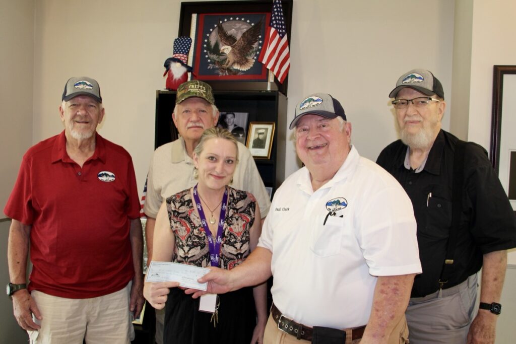 In their last official act, Union County Gun Club Members Wayne Roshaven, Mack Mason, Paul Clark and Lamar Franklin donated remaining club funds to the Union County Senior Center, represented by Center Director Laura Briggs. Photo by Shawn Jarrard