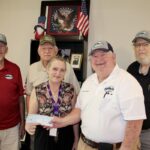 In their last official act, Union County Gun Club Members Wayne Roshaven, Mack Mason, Paul Clark and Lamar Franklin donated remaining club funds to the Union County Senior Center, represented by Center Director Laura Briggs. Photo by Shawn Jarrard
