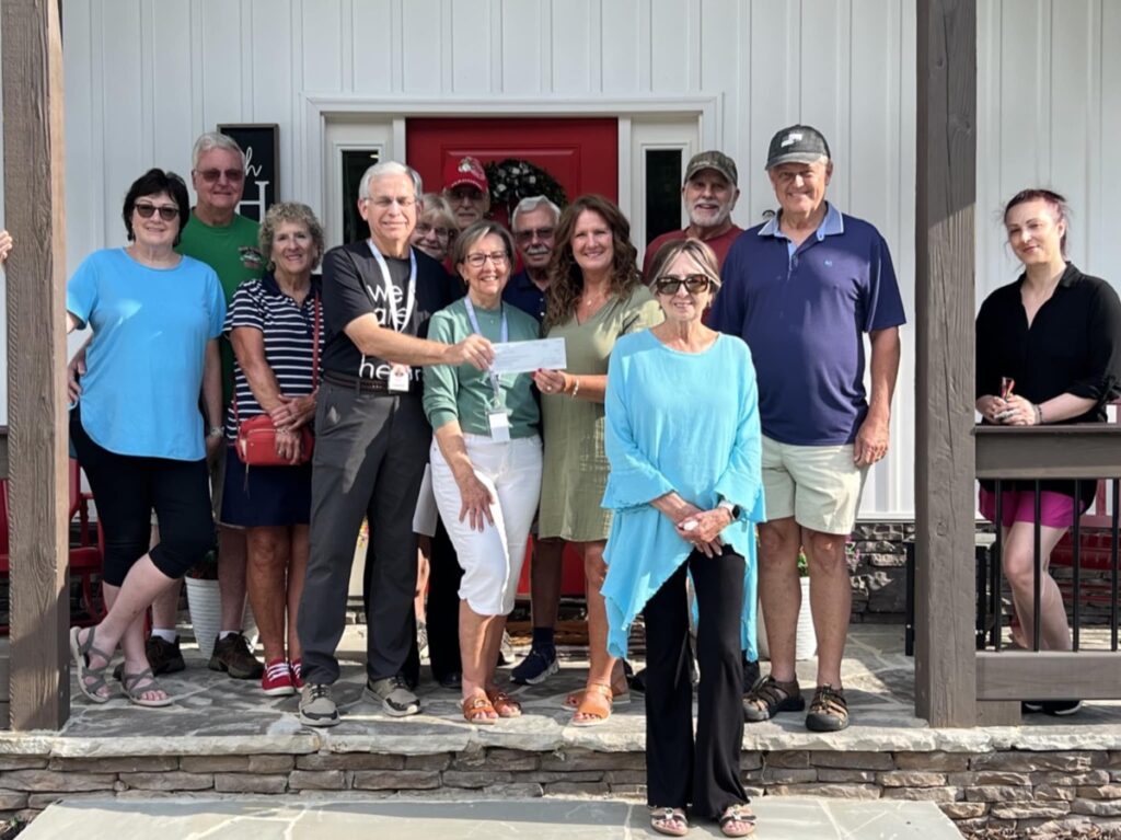 Isaiah 117 House recently met with generous community members to receive a donation benefitting the local nonprofit. Photo by Brittany Holbrooks