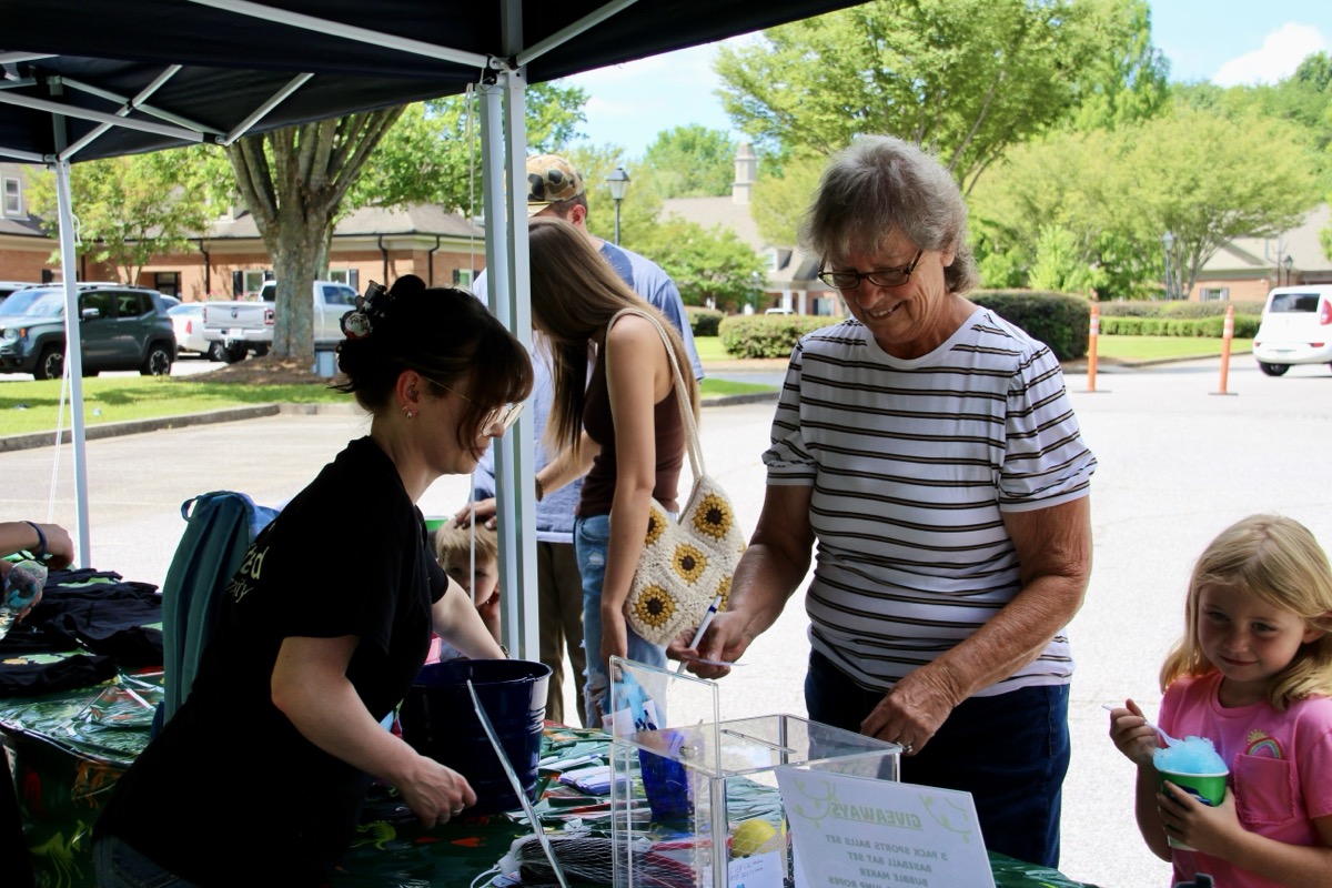 United Community employees facilitated a drawing for a free backpack full of supplies as part of the “Back to School” event that was also attended by American Legion Auxiliary Unit 121 volunteers handing out delicious baked goods.