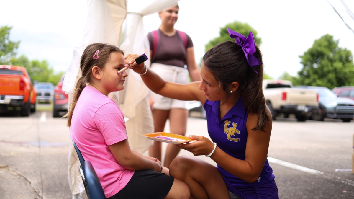 Union County Schools cheerleaders volunteered to paint faces and help with crafts at the back-to-school event on Saturday. Photo by Daysha Pandolph