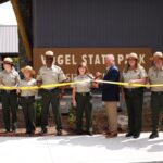 Park rangers and community members gathered at Vogel State Park’s new visitor center on Thursday, Aug. 7, for a ribbon-cutting ceremony. Photo by Daysha Pandolph