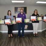 The principals of the five campuses across Union County Schools received certificates of accreditation and recognition in the July School Board meeting. Photo by Brittany Holbrooks