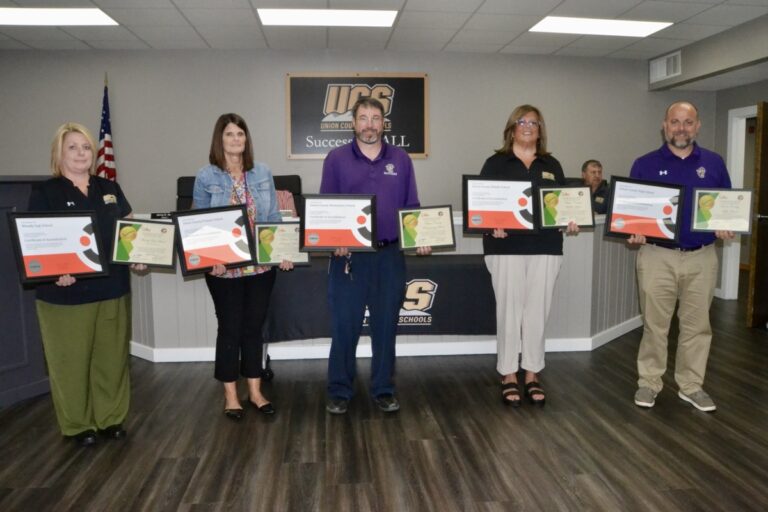 The principals of the five campuses across Union County Schools received certificates of accreditation and recognition in the July School Board meeting. Photo by Brittany Holbrooks
