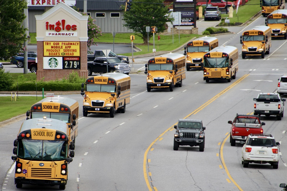 Dozens of school buses hit the road last Wednesday afternoon to ferry children home from their first day of the 2025-2026 academic year. Photo by Shawn Jarrard