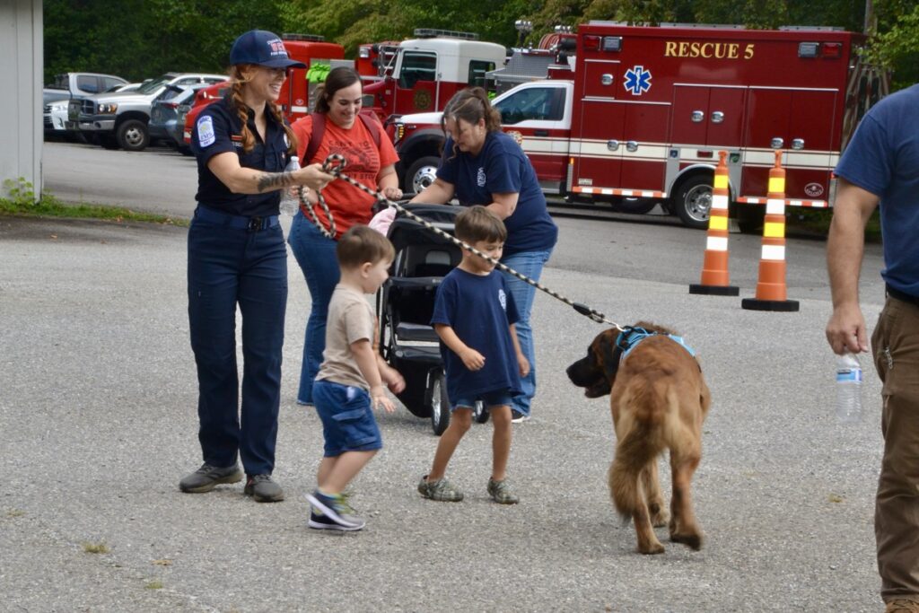 Kids and other members of the public enjoyed meeting Suches Firefighter Chris Disser’s friendly pooch Mack during the annual Open House earlier this month. Photo by Brittany Holbrooks