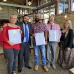(L-R) NEDC Graduate Sheila Larson, Judge Buck Levins, Graduate Robert Byrd, Graduate David Goyette and Program Coordinator Tashina Eller at the graduation ceremony on Sept. 11. Photo by Samantha Laratta