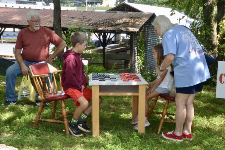 Among the many things to do at this year’s Mountain Heritage Festival, the age-old pastime of checkers provided families with a fun activity that was popular with the area’s forebears. Photo by Brittany Holbrooks