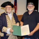 Jared Ogden with the Blue Ridge Mountains Chapter Sons of the American Revolution accepting a Constitution Week proclamation from Sole Commissioner Harold Collins on Sept. 18. Photo By Shawn Jarrard