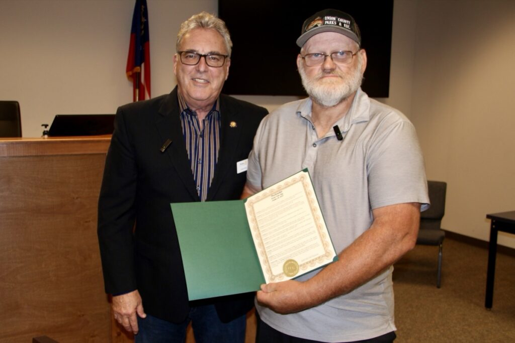 Rotary Club of Union County President Chuck Henz and Sole Commissioner Harold Collins for the World Polio Day Proclamation last week. Photo by Shawn Jarrard