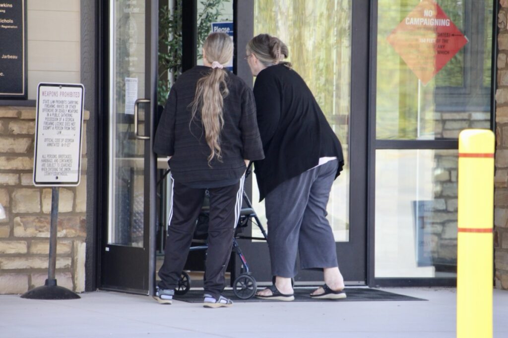 Two of the 484 local voters who cast ballots through Week 1 of early voting, pictured here at the Voting Center. Photo by Shawn Jarrard
