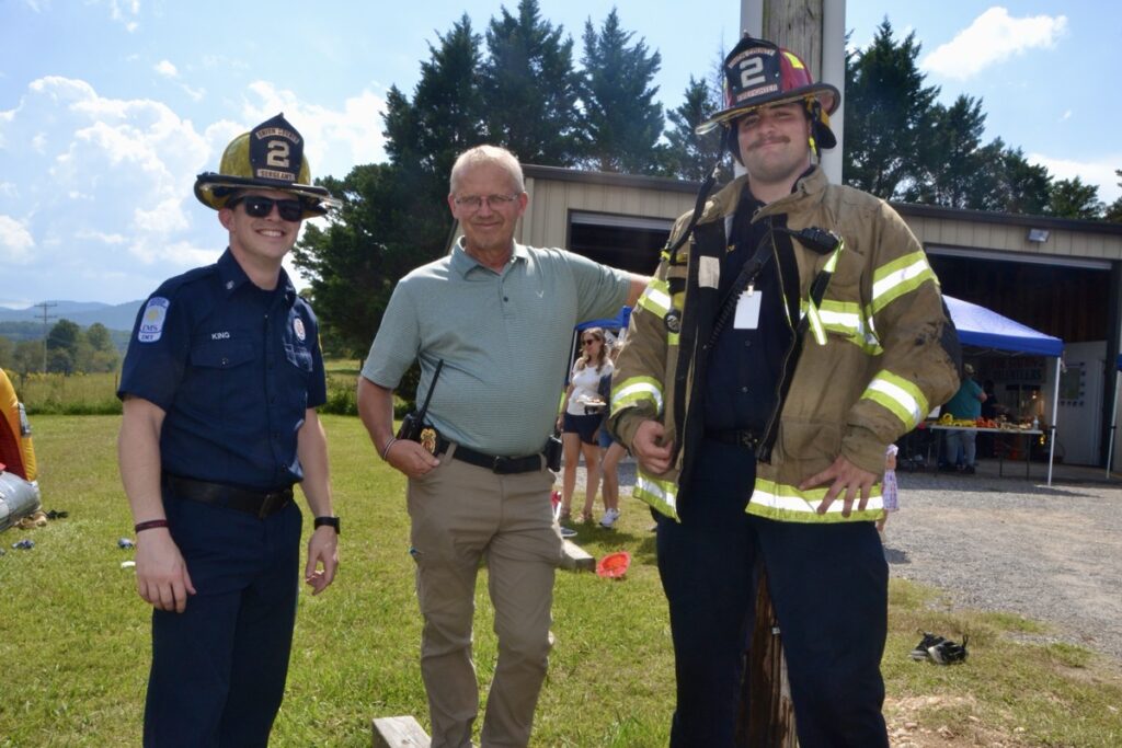 UCFD Station 2 volunteers with Battalion Chief Richard Jones, center, at the recent educational Open House off Jones Creek Road. Photo by Brittany Holbrooks
