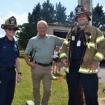 UCFD Station 2 volunteers with Battalion Chief Richard Jones, center, at the recent educational Open House off Jones Creek Road. Photo by Brittany Holbrooks