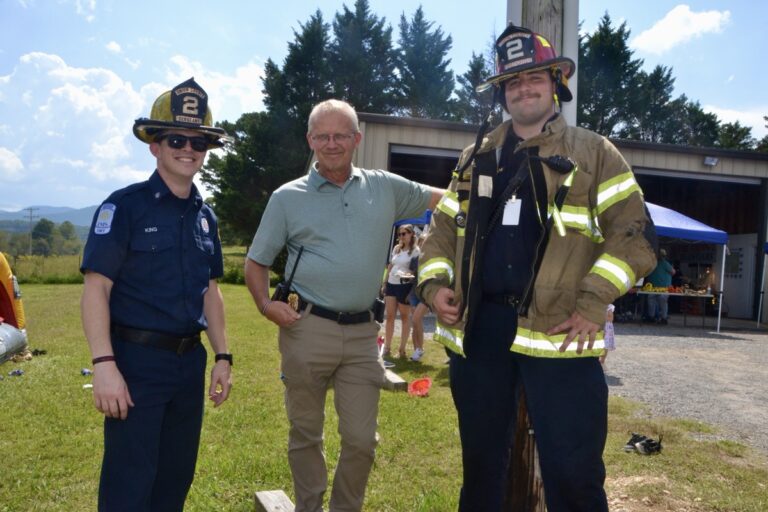 UCFD Station 2 volunteers with Battalion Chief Richard Jones, center, at the recent educational Open House off Jones Creek Road. Photo by Brittany Holbrooks