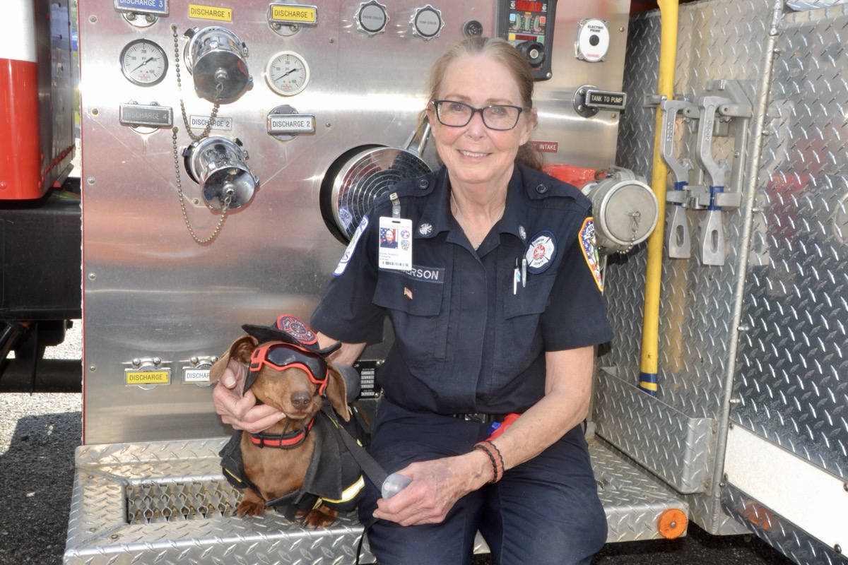 Station 2 Volunteer Firefighter Shirley Anderson with her cute dachshund Samson at their annual Open House last month. Photo by Brittany Holbrooks
