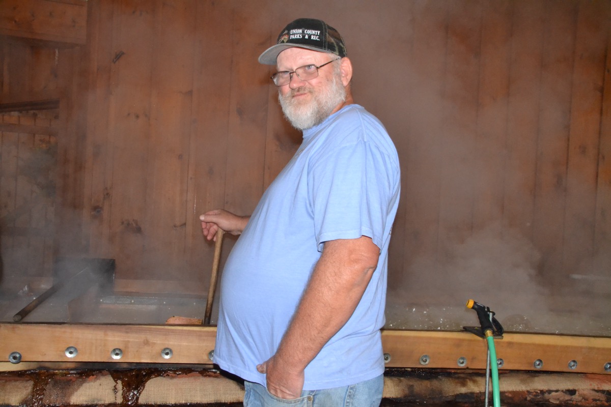 Sole Commissioner Harold Collins played a crucial role in making the Sorghum in the Mountains Festival a reality this year – and apparently in cooking up sorghum syrup at Meeks Park. Photo by Brittany Holbrooks