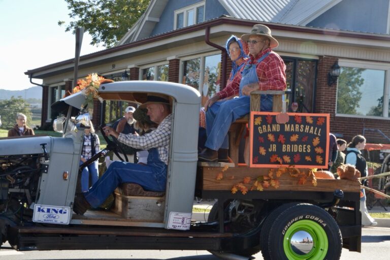Junior Bridges, pictured here with wife Carolyn, led the inaugural Sorghum in the Mountains Festival Parade as Grand Marshal, which was fitting, as he helped found the original festival back in 1969. Photo by Brittany Holbrooks