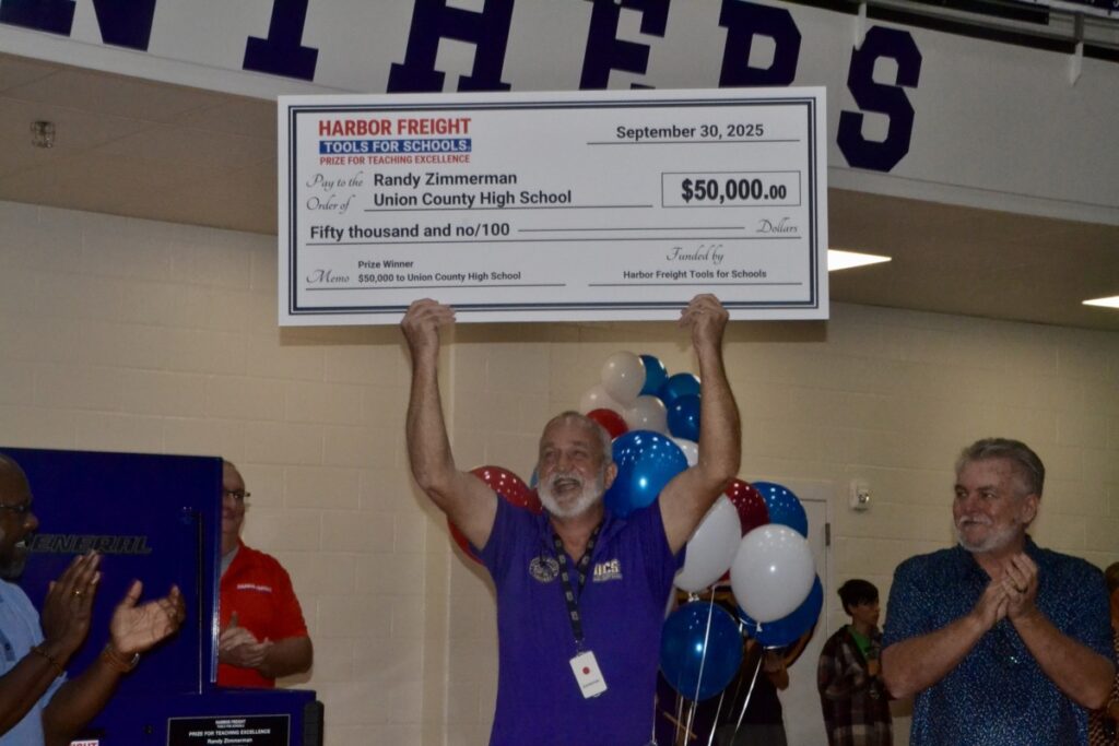 UCHS Automotive Paint & Body Teacher Randy Zimmerman celebrating last week after being surprised with a major award that came with $50,000 for his classroom. Photo by Brittany Holbrooks