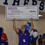 UCHS Automotive Paint & Body Teacher Randy Zimmerman celebrating last week after being surprised with a major award that came with $50,000 for his classroom. Photo by Brittany Holbrooks